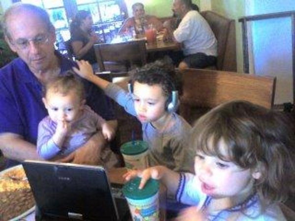 This is a picture of Stephen Krashen with three children
